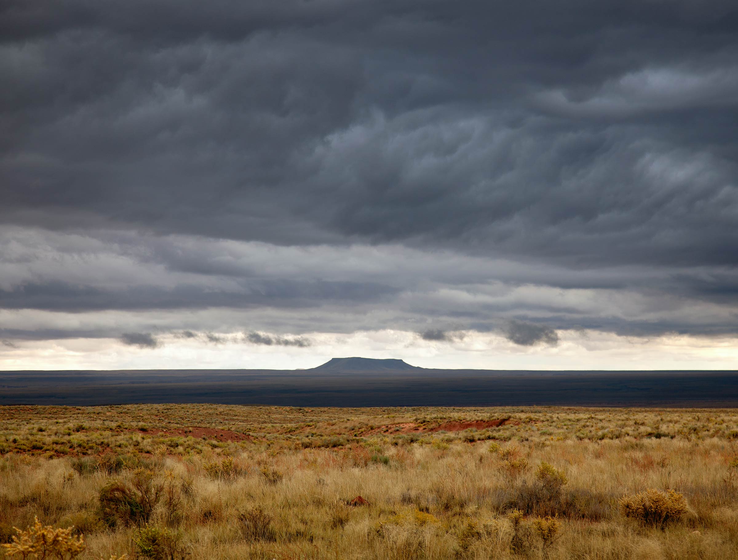 Distant Butte in Storm